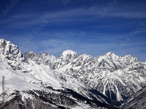 Snowy mountains in wind sunny day © BSANI