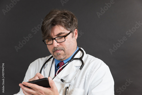 Doctor Taking Notes on Generic Computer Tablet