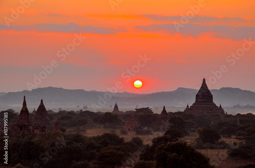 Ancient stupas, pagodas and temples of Bagan (Myanmar) at sunset photo