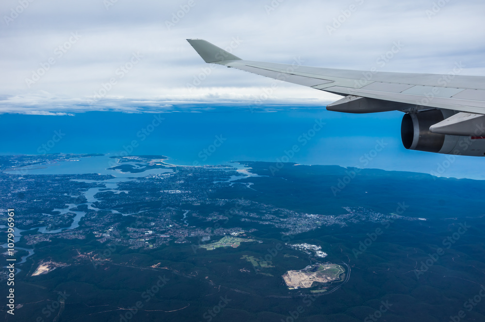 Airplane travel views out of aircraft window during flight and landing Airplane travel views out of aircraft window during flight and landing
