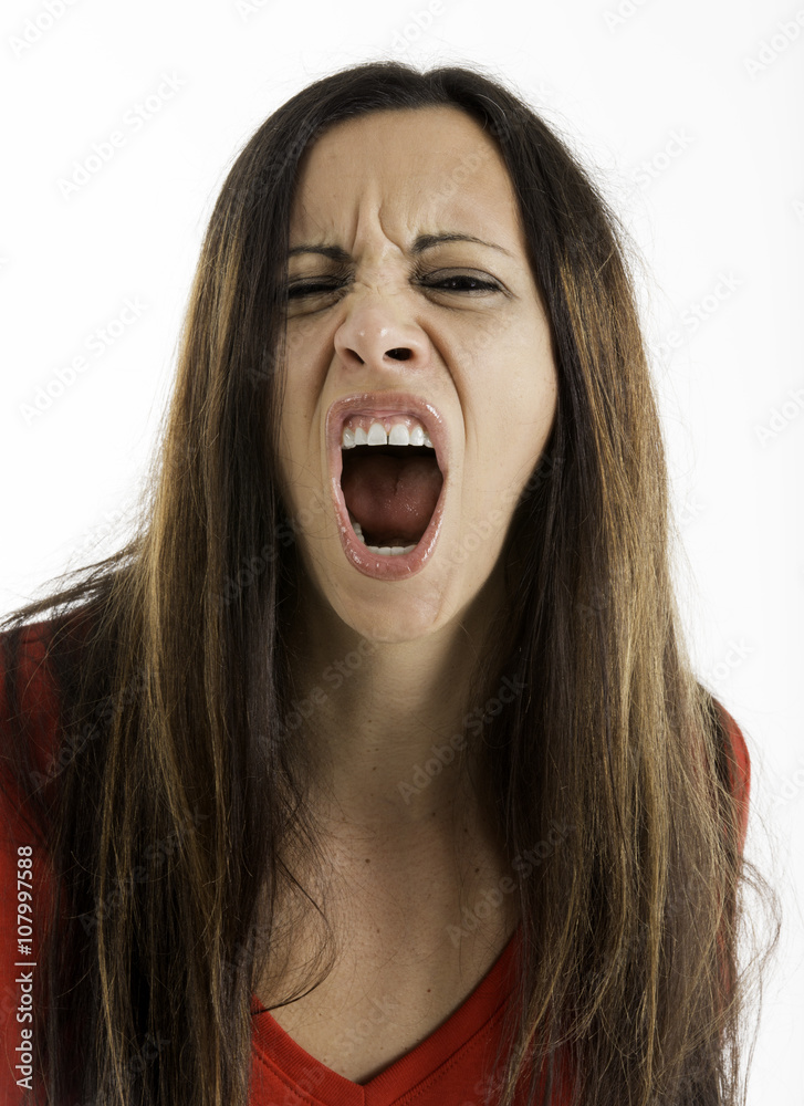 Angry woman look looking at camera and yelling, Shot on a white background.
Angry woman look looking at camera and yelling, Shot on a white background.