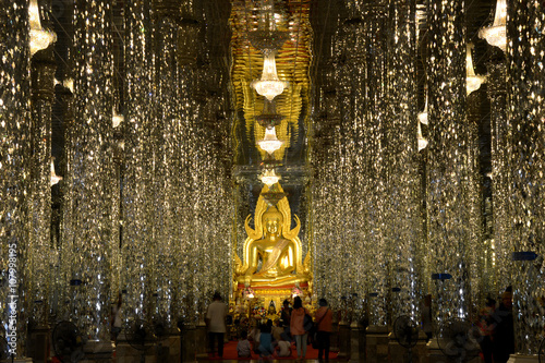 Golden Buddha (Phra Putta Chinnarat) statue at Cathedral Glass, Wat Tha Sung Temple, Uthai Thani, Thailand