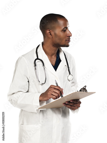 doctor looking away while making notes.