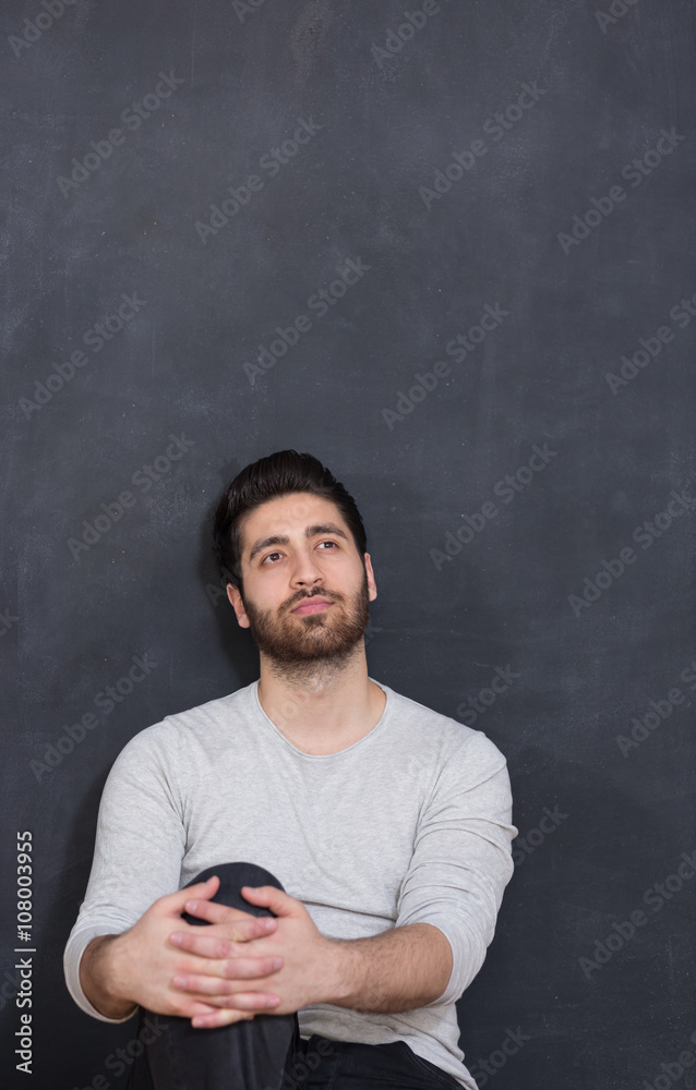 portrait of Happy young man looking up to copy space
