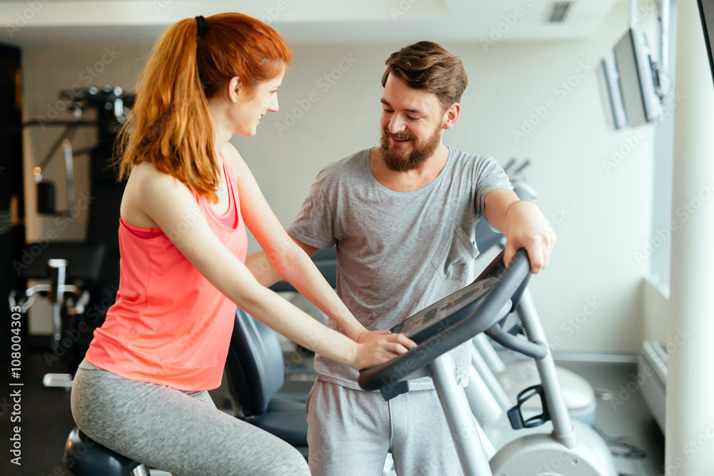 Personal trainer giving instructions Personal trainer giving instructions