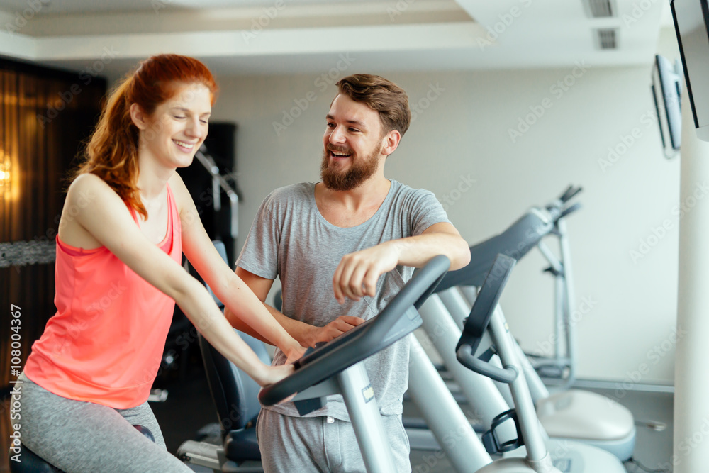 Personal trainer giving instructions Personal trainer giving instructions