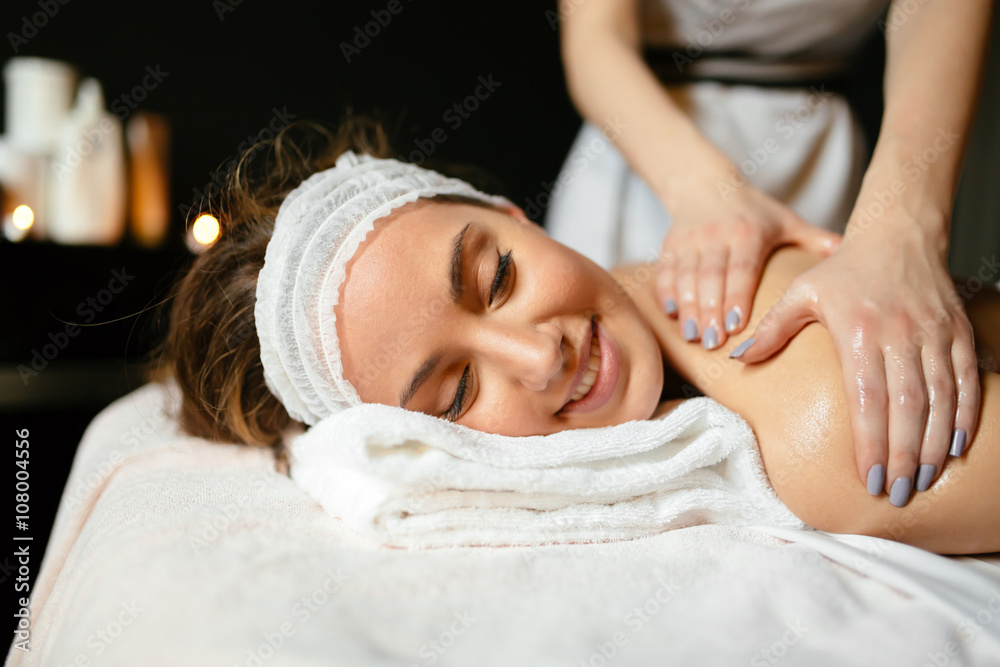 Massage therapist massaging woman Massage therapist massaging woman