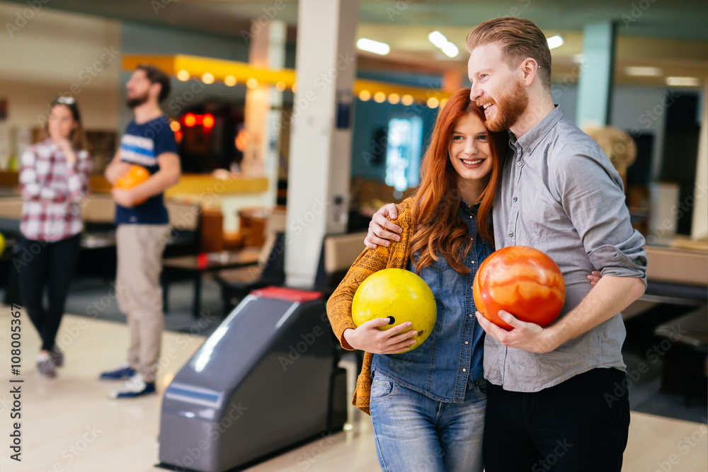Fototapeta premium Beautiful couple dating and bowling