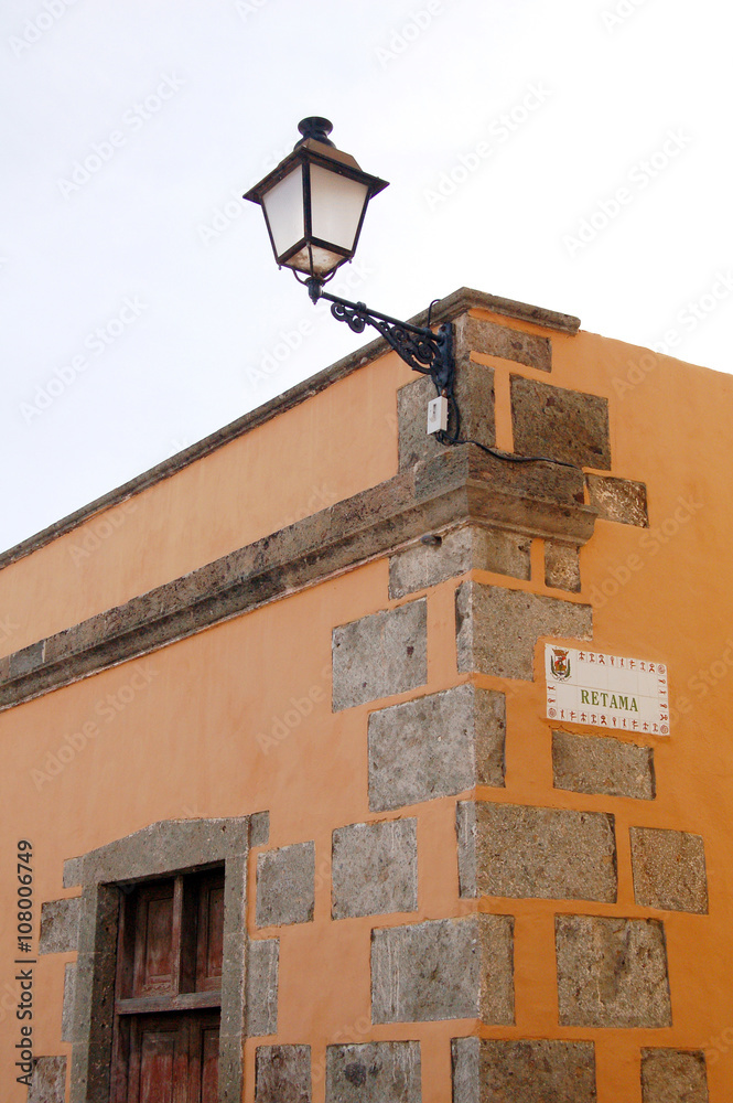 Orange painted house with lantern on Canary islands