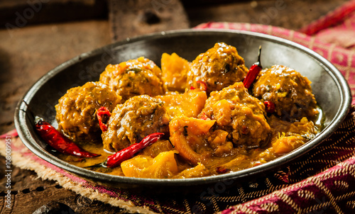 Canvas Print Traditional Tajine Dish of Yellow Curry Meatballs