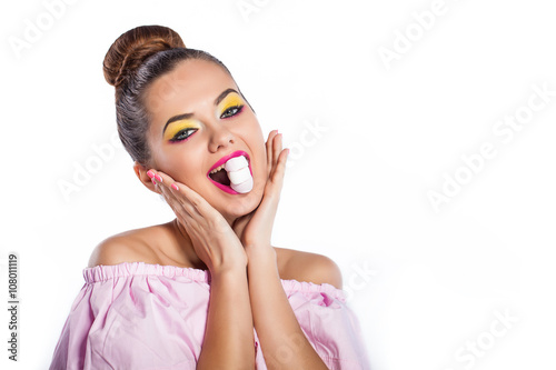 Beauty fashion model girl with colorful makeup with sweets. Diet,dieting concept. Sweets. Colorful background.