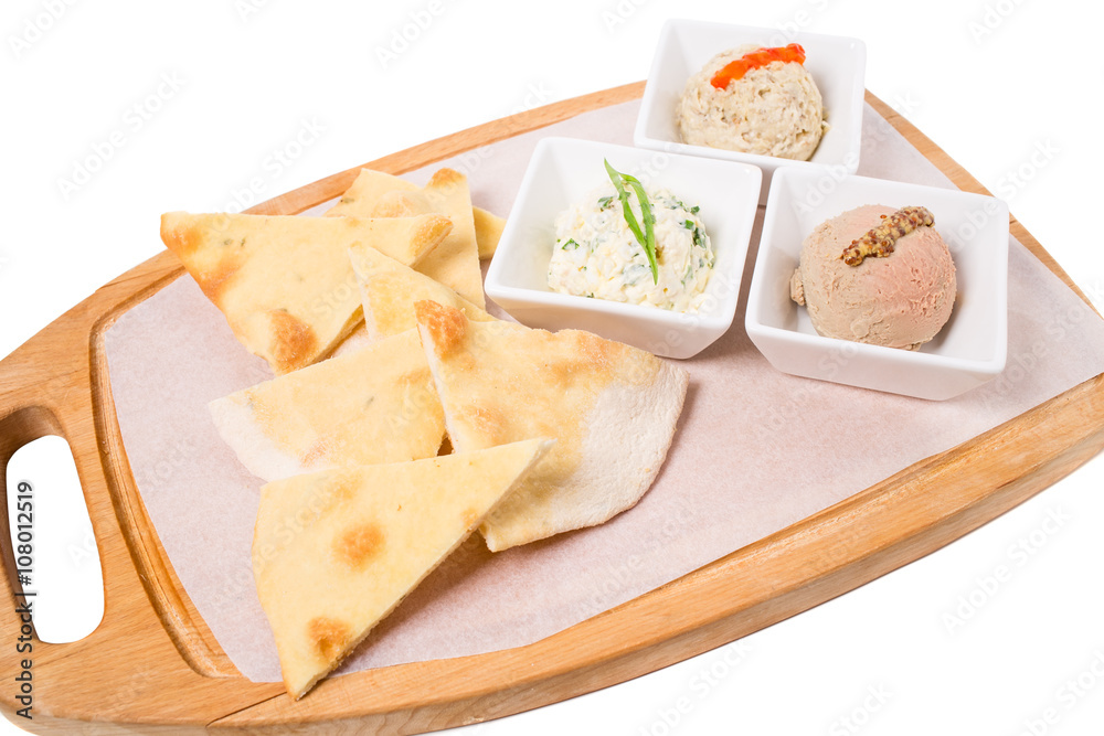 Platter with italian focaccia and various pates.
