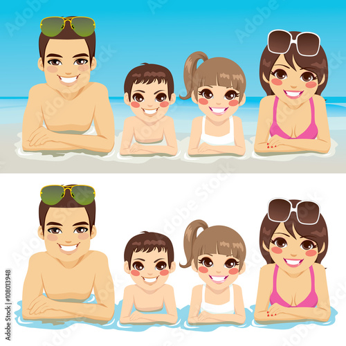 Happy family lying down on sea shore together smiling