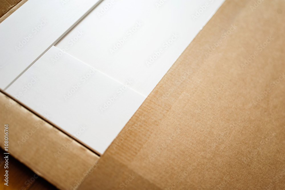 New white furniture after relocation - opening cardboard box New white furniture after relocation - opening cardboard box