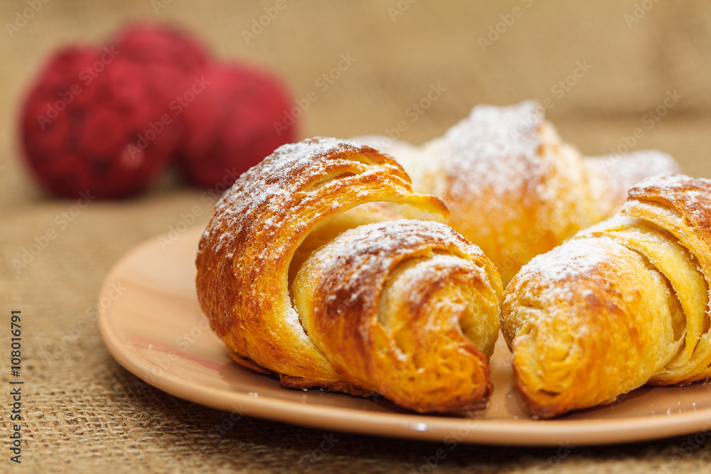 fresh three croissants on plate