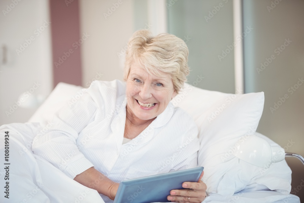 Portrait of happy senior woman using digital tablet Portrait of happy senior woman using digital tablet