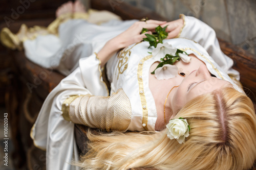 фотографія Sleeping beauty lying on the table