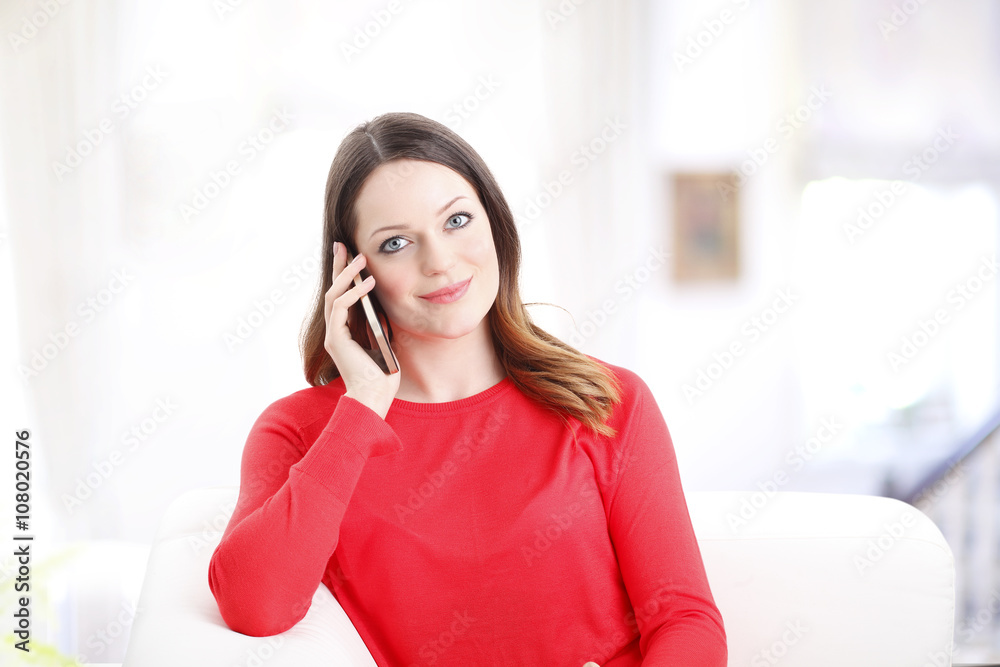 Young woman with handy