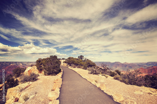 Vintage toned path to the Grand Canyon South Rim viewpoint. photo