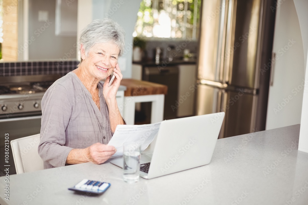 Happy senior woman talking on mobile phone Happy senior woman talking on mobile phone