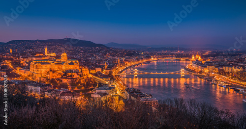Panoramic View of Budapest with Street Lights and the Danube River at Twilight as Seen from Gellert Hill Lookout Point photo