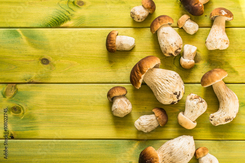 Boletus mushrooms, fresh, whole on wooden table.
