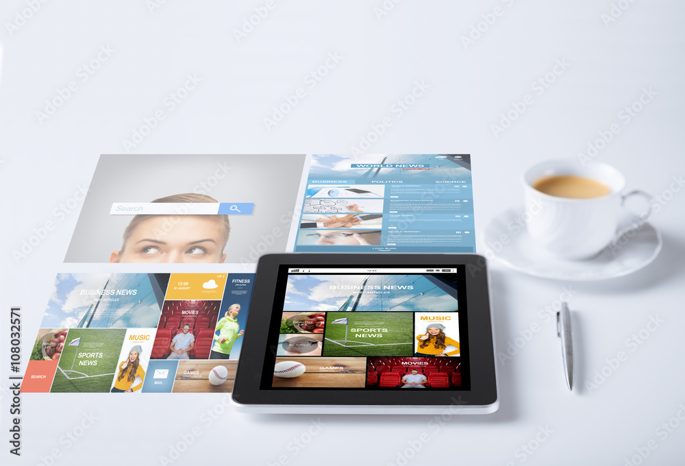 tablet pc with news application and coffee cup tablet pc with news application and coffee cup