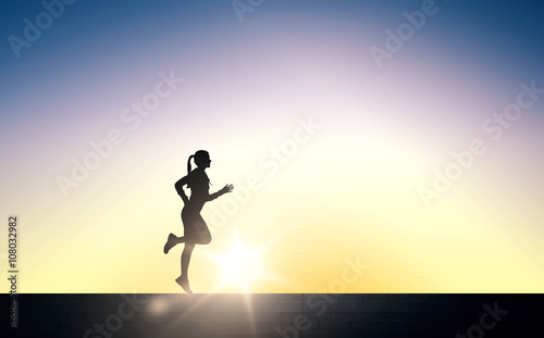 happy young sports woman running outdoors