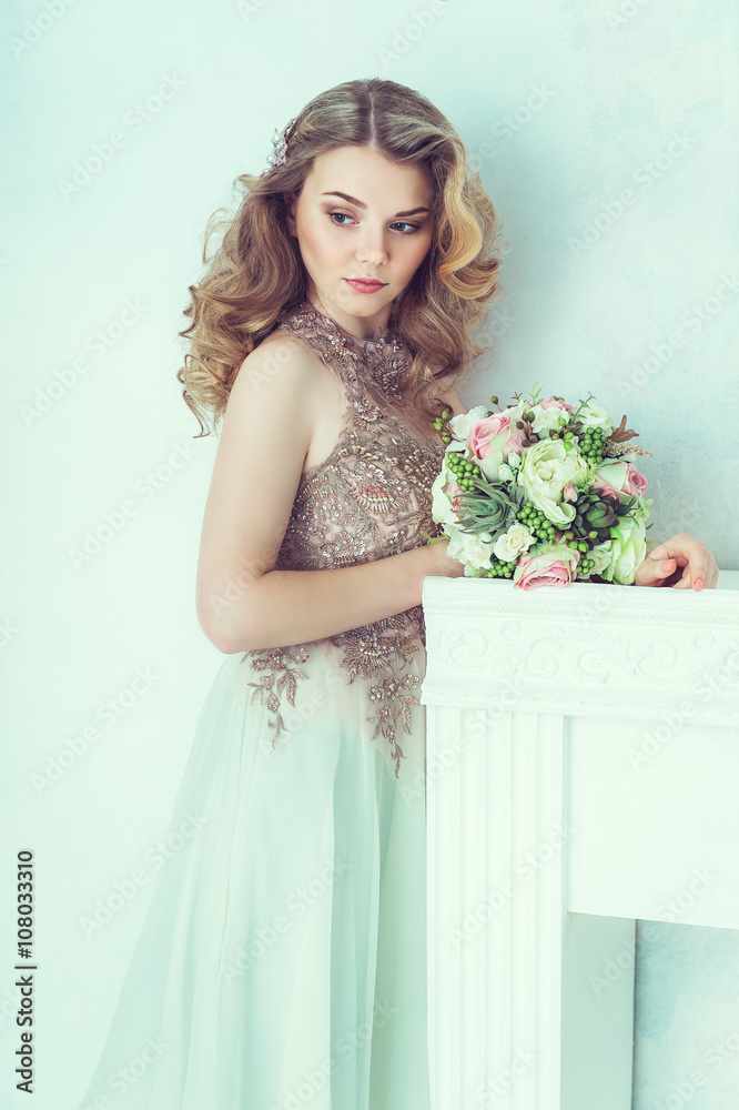 Beautiful bride in wedding dress. Portrait of young bride. Studio shot.
Beautiful bride in wedding dress. Portrait of young bride. Studio shot.