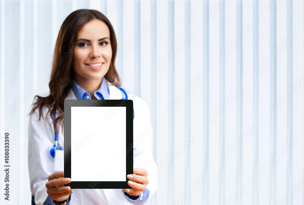 Doctor showing blank tablet pc for copyspace Doctor showing blank tablet pc for copyspace