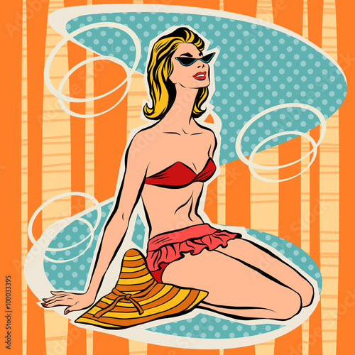 Girl in bikini sitting on beach