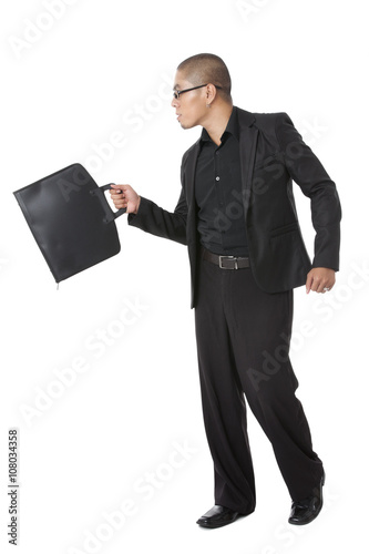 young businessman holding briefcase
