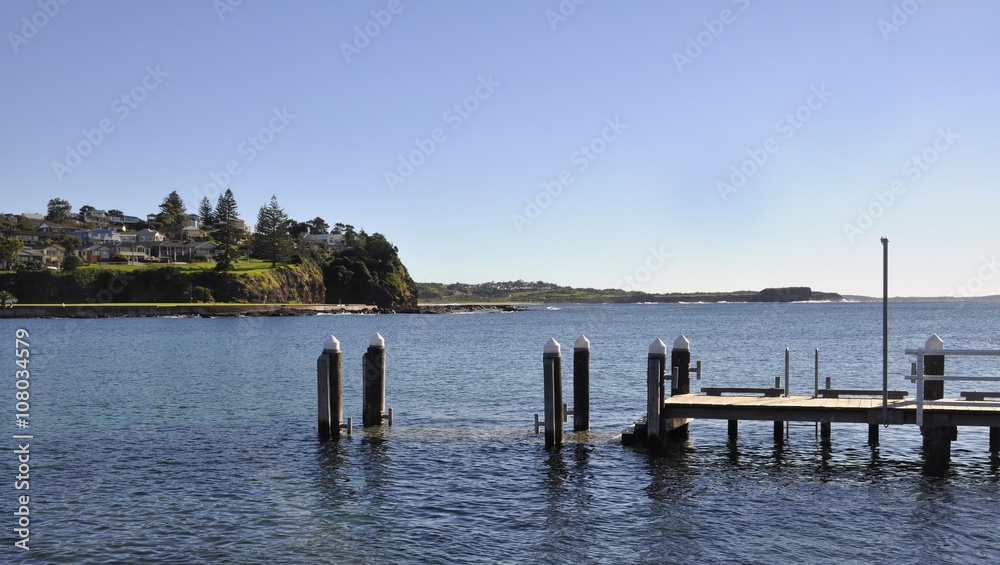 Pier at Robertson Basin , Pleasant Point in the background; Kiama New South Wales Australia