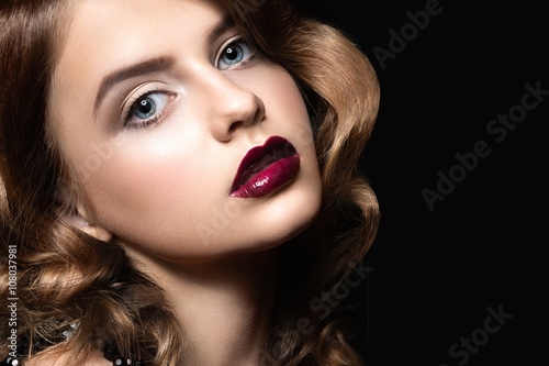 Fotografie Beautiful brunette in Hollywood manner with curls, dark lips