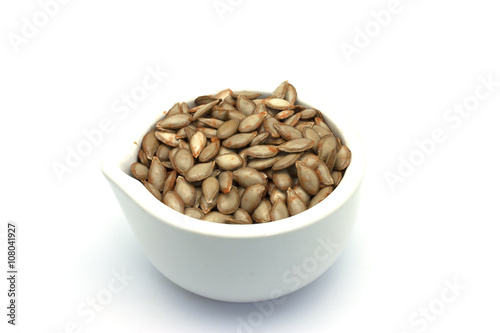 Cucurbita Moschata Fresh Seeds in White Mortar and Pestle
