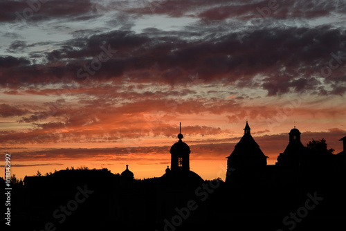Silhouette of church on the sunset background