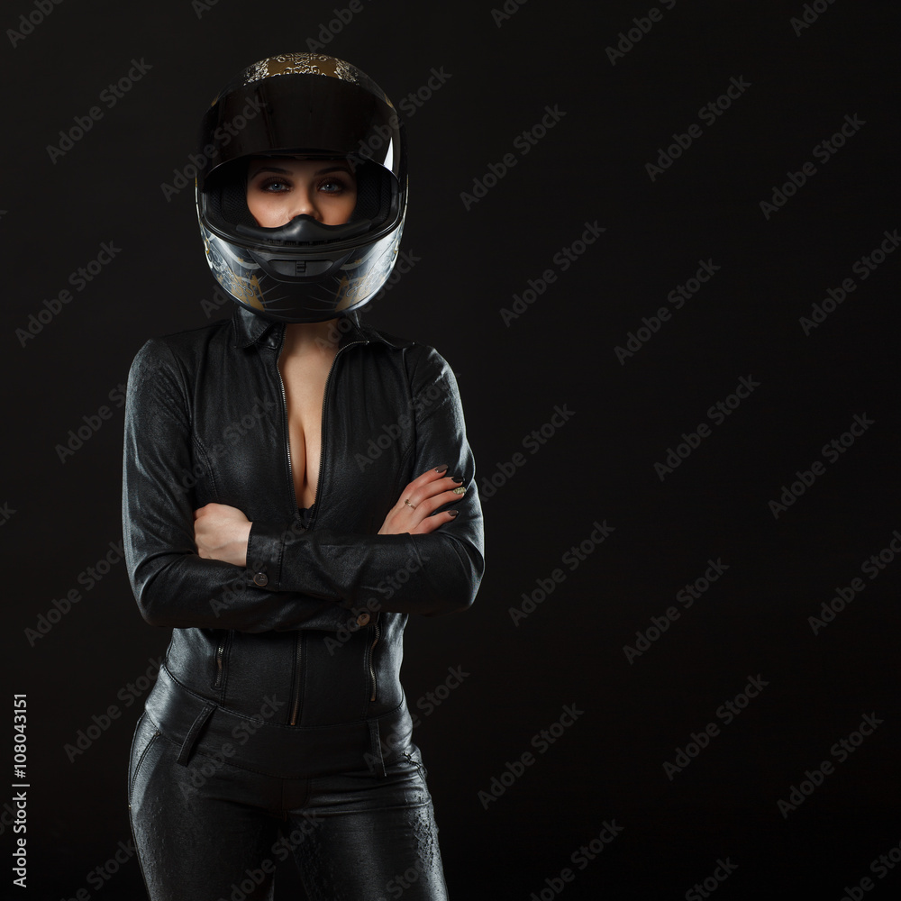 biker girl posing in studio biker girl posing in studio