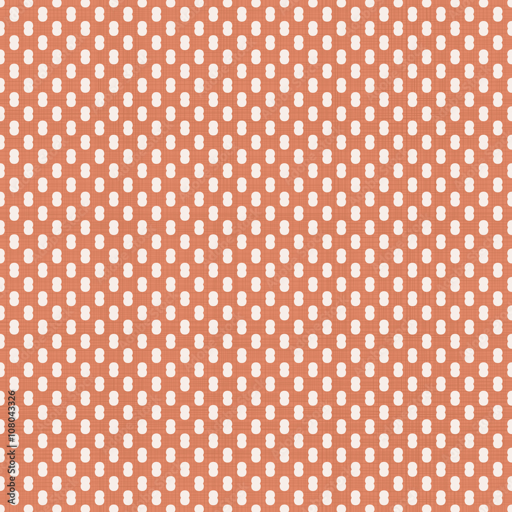 abstract polka dot seamless pattern in faded orange color with fabric texture