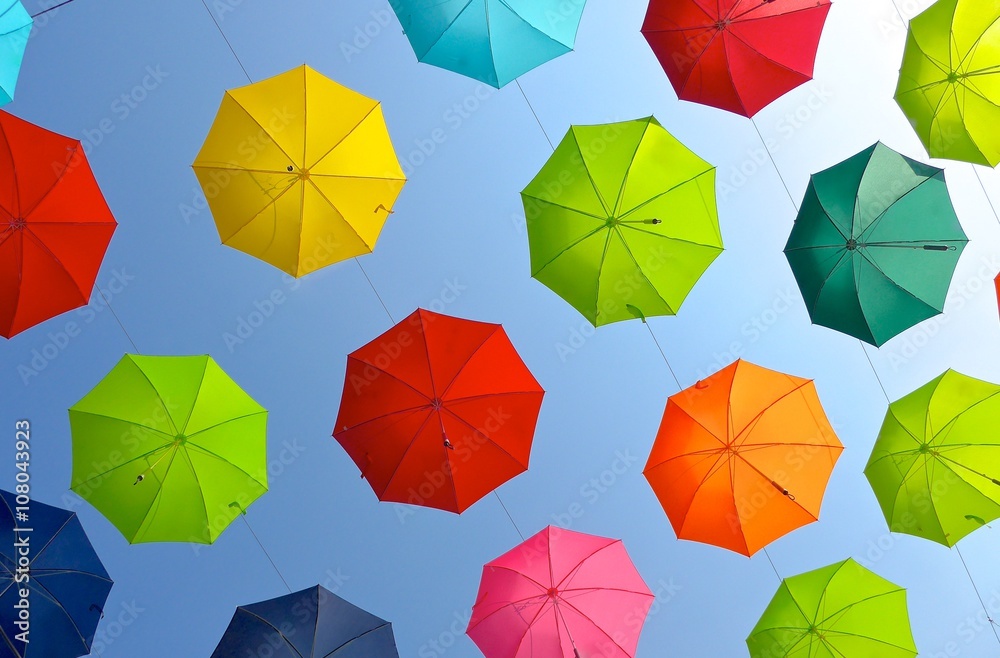 Lots of umbrellas for decoration over the street in the sky Lots of umbrellas for decoration over the street in the sky