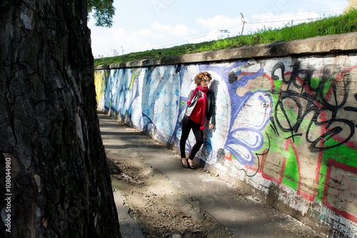 Wallpaper Mural Gorgeous brunette woman posing with graffiti on the street... Torontodigital.ca