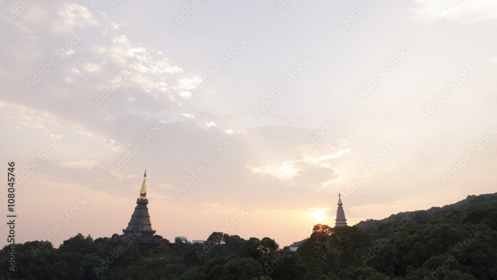 view of asian buddhist pagoda during sunset