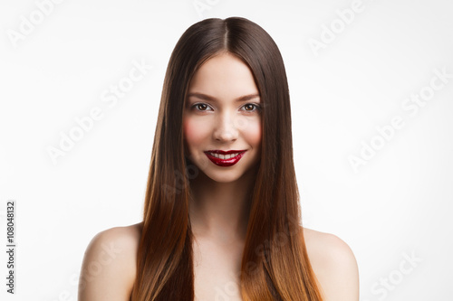 Beauty portrait of young brunette woman with red lips on white