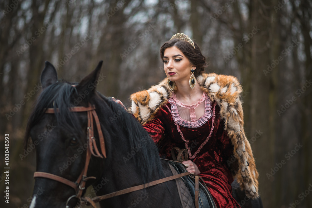 Fototapeta premium Princess with her horse in the woods