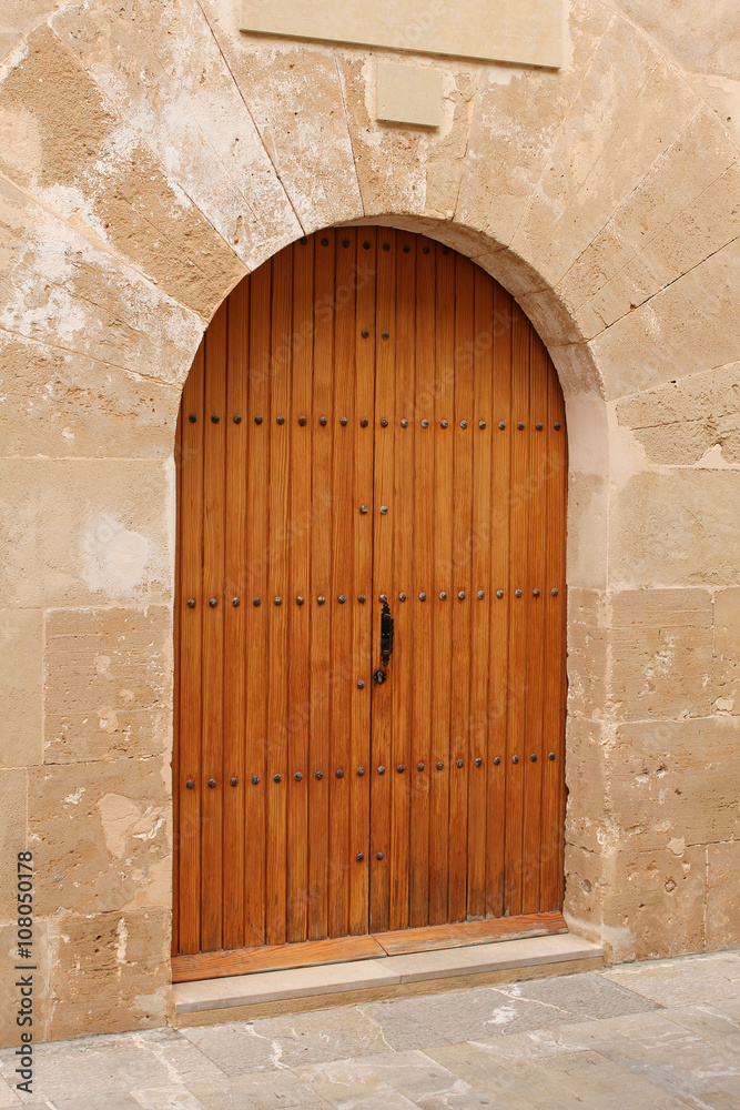 wooden door in stone wall, mediterranean style wooden door in stone wall, mediterranean style
