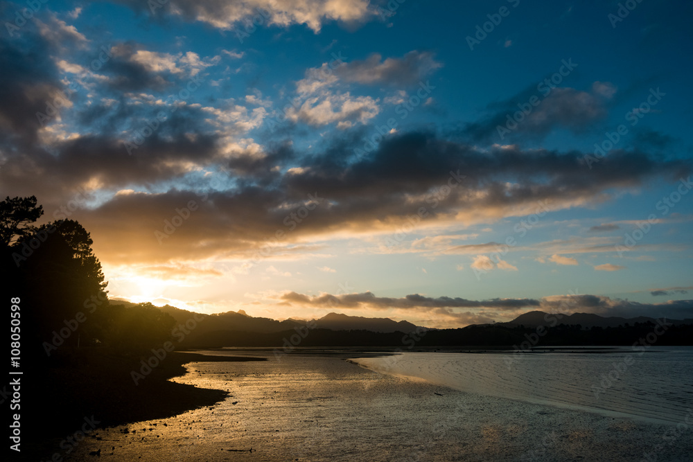 sunrise in sea bay New Zealand