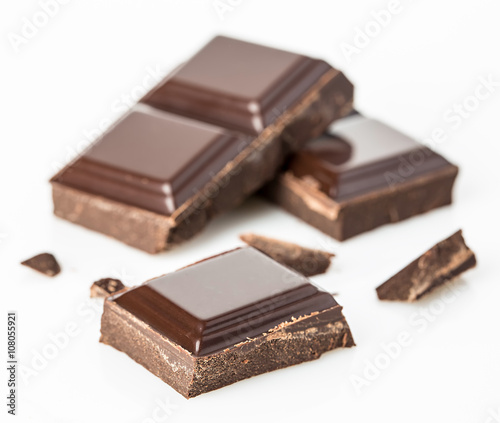 Chocolate bars isolated on white background. Selective focus.