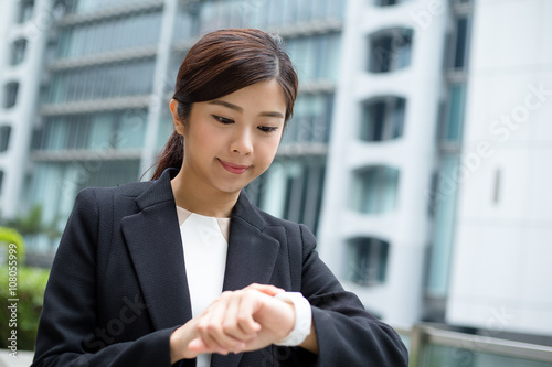 Businesswoman use of wearable smart watch