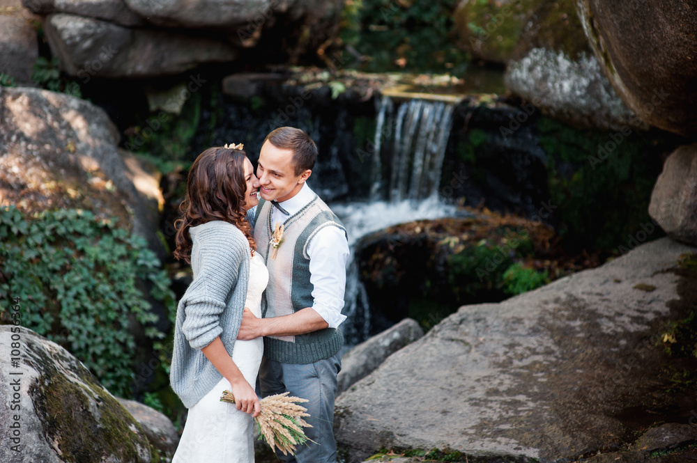 beautiful couple hugging near a mountain river beautiful couple hugging near a mountain river