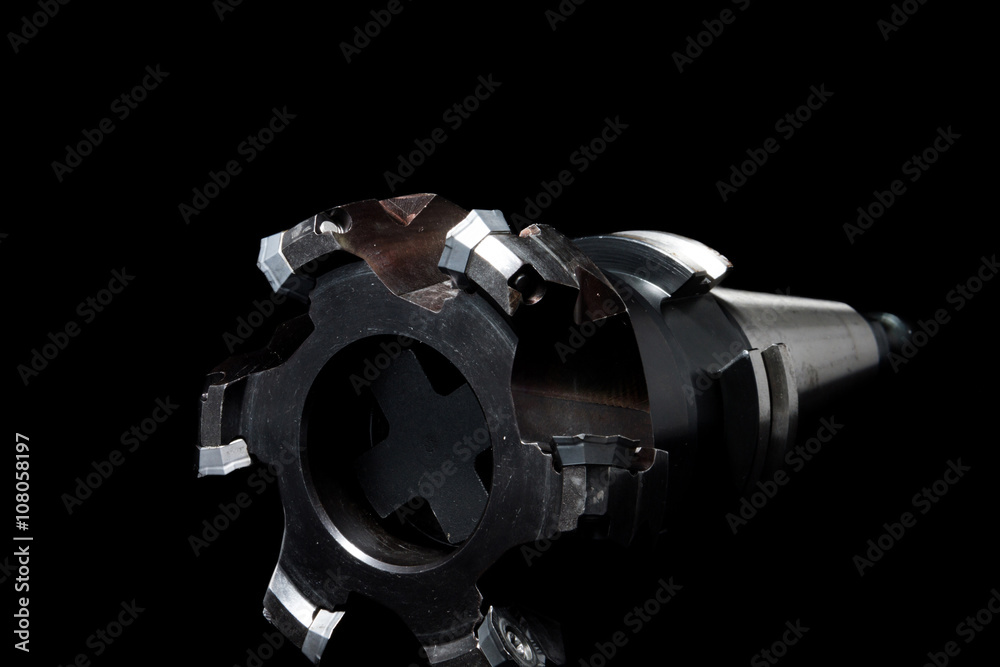 Metal milling tool / equipment with holder for cnc machine for heavy industry on black background Metal milling tool / equipment with holder for cnc machine for heavy industry on black background