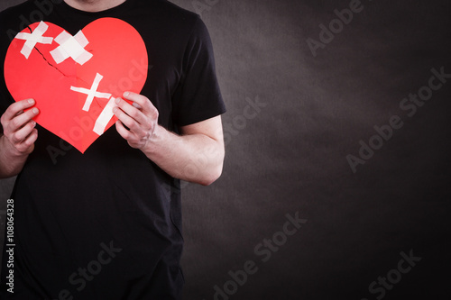 Unhappy man with broken heart. photo